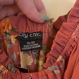 Size XL/22 city chic pink floral romper. Never worn, tags still attached